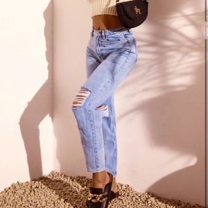 Blue ripped mom jeans.